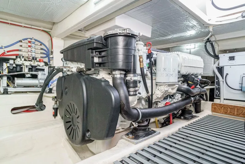 Slide: The Image of Engine room of 2016 Tiara Yachts C44 Coupe, showcasing mechanical components and systems. - 44