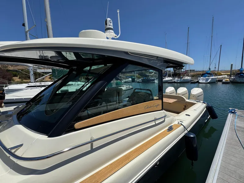 Slide: The Image of 2023 Chris-Craft Calypso 35 boat docked at marina, showcasing sleek design and luxury features. - 20