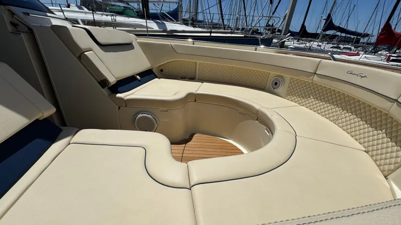 Slide: The Image of Luxurious seating on 2023 Chris-Craft Calypso 35 boat, featuring elegant beige upholstery. - 22