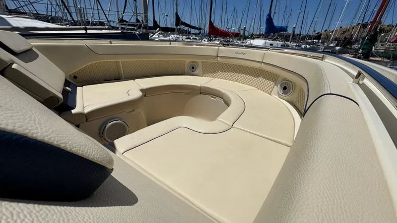 Slide: The Image of Luxurious seating area on 2023 Chris-Craft Calypso 35 boat, docked in marina. - 23