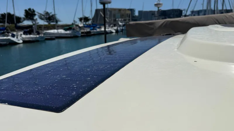 Slide: The Image of 2023 Chris-Craft Calypso 35 with solar panel, docked in marina. - 24