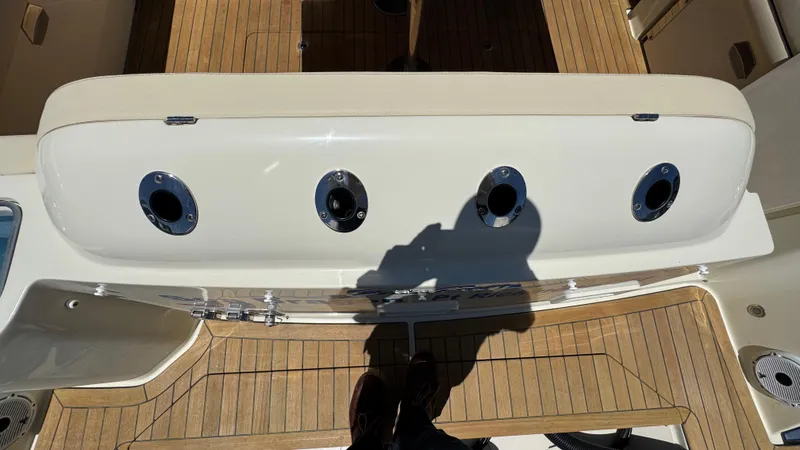 Slide: The Image of 2023 Chris-Craft Calypso 35 boat deck with rod holders and teak flooring. - 31