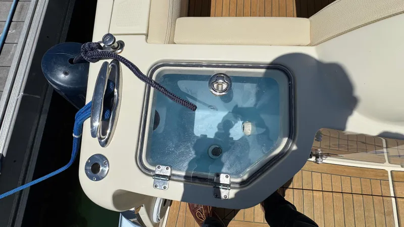 Slide: The Image of 2023 Chris-Craft Calypso 35 boat deck with livewell and seating area. - 32