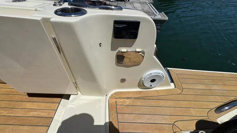 Slide: The Image of 2023 Chris-Craft Calypso 35 boat deck with teak flooring and water access. - 34