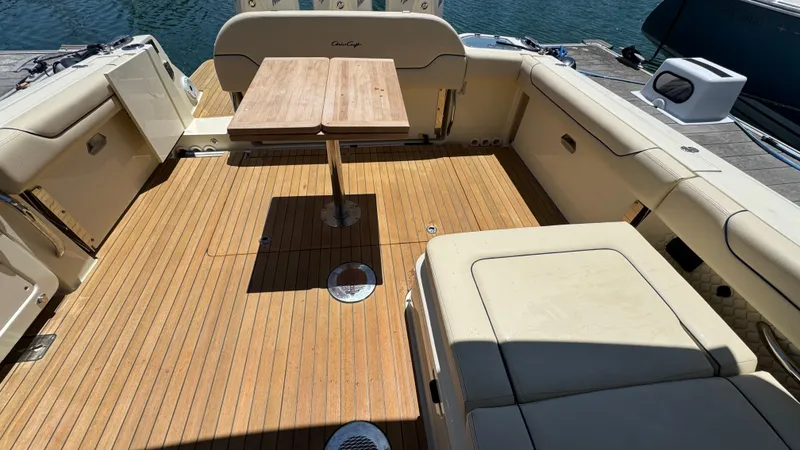 Slide: The Image of 2023 Chris-Craft Calypso 35 boat interior with wooden deck and seating area. - 4