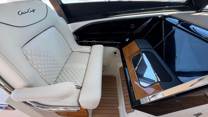 Slide: The Image of Luxurious interior of 2023 Chris-Craft Calypso 35 with elegant seating and sleek dashboard design. - 40