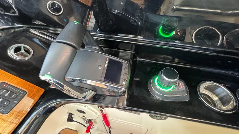 Slide: The Image of Control panel of 2023 Chris-Craft Calypso 35 boat with joystick and throttle. - 42