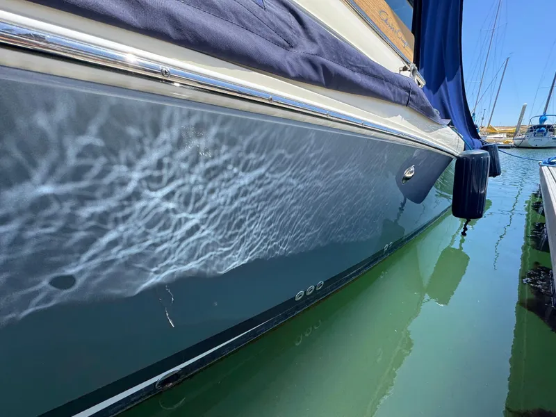Slide: The Image of 2023 Chris-Craft Calypso 35 boat reflecting water patterns in a marina. - 48