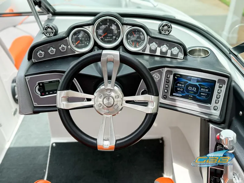 Slide: The Image of 2017 MasterCraft XT20 dashboard with steering wheel, gauges, and digital display. - 15