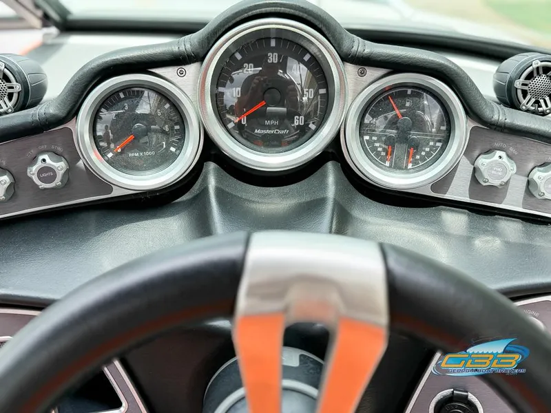 Slide: The Image of Dashboard of a 2017 MasterCraft XT20 boat with speedometer and controls. - 17