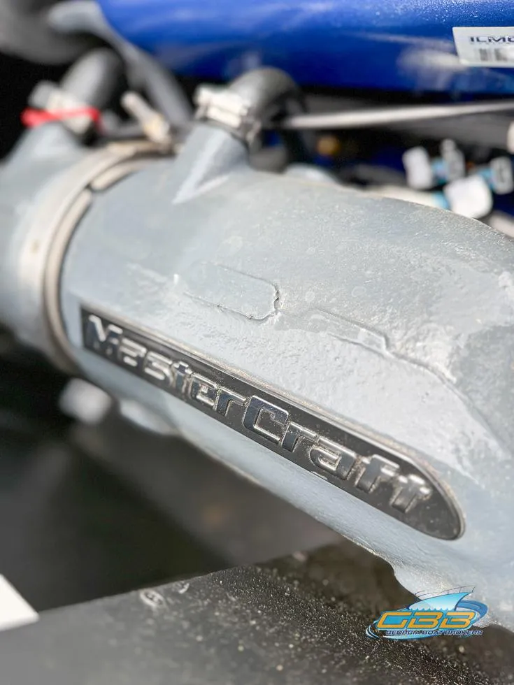 Slide: The Image of Close-up of 2017 MasterCraft XT20 engine component with logo. - 26