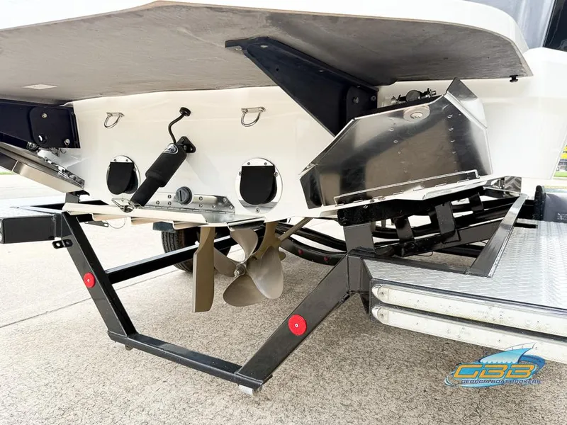 Slide: The Image of 2017 MasterCraft XT20 boat on trailer, showing propeller and rear details. - 7