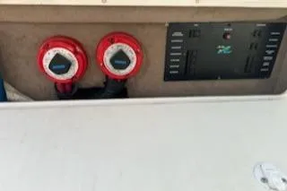 Slide: The Image of Control panel of 2000 Sea Ray 310 Sundancer boat with red switches. - 14