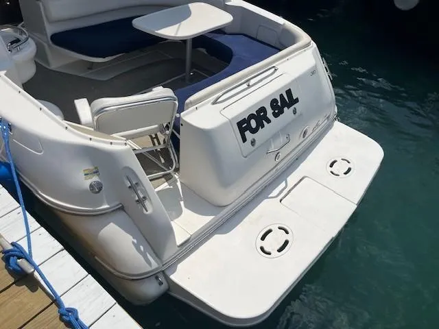 Slide: The Image of Cockpit view of 2000 Sea Ray 310 Sundancer with steering wheel and control panel. - 3