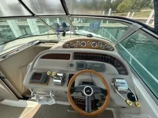 Slide: The Image of Interior of 2000 Sea Ray 310 Sundancer, featuring cozy cabin and modern amenities. - 4