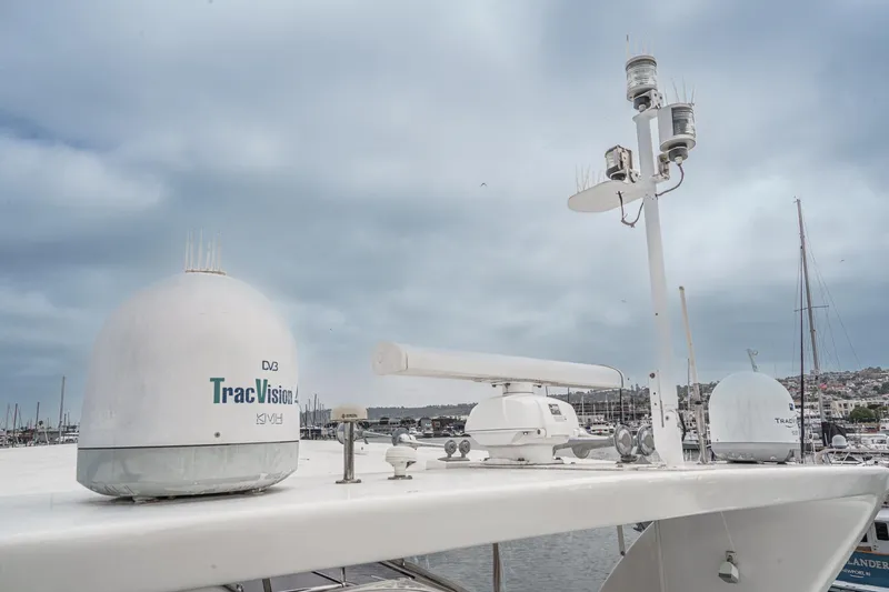 Slide: The Image of Rooftop equipment on a 1999 Horizon 70 Motor Yacht, featuring TracVision satellite domes. - 22