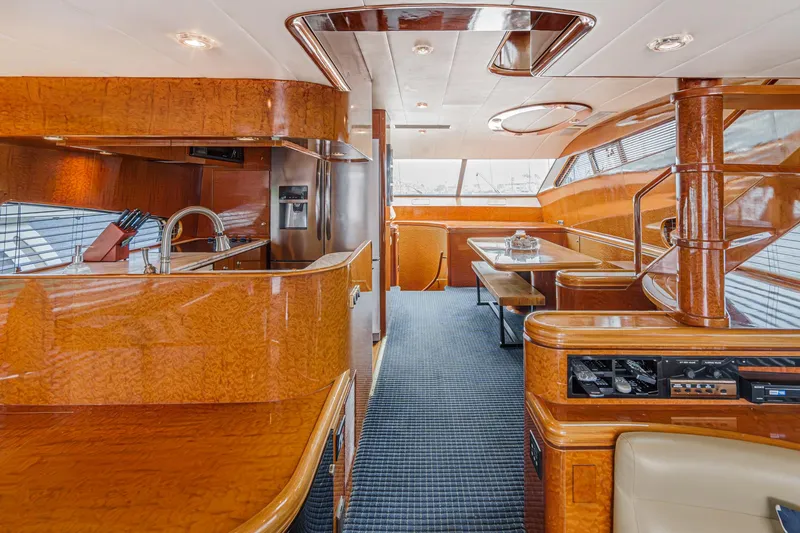 Slide: The Image of Luxurious interior of 1999 Horizon 70 Motor Yacht with elegant wood finishes and modern amenities. - 32
