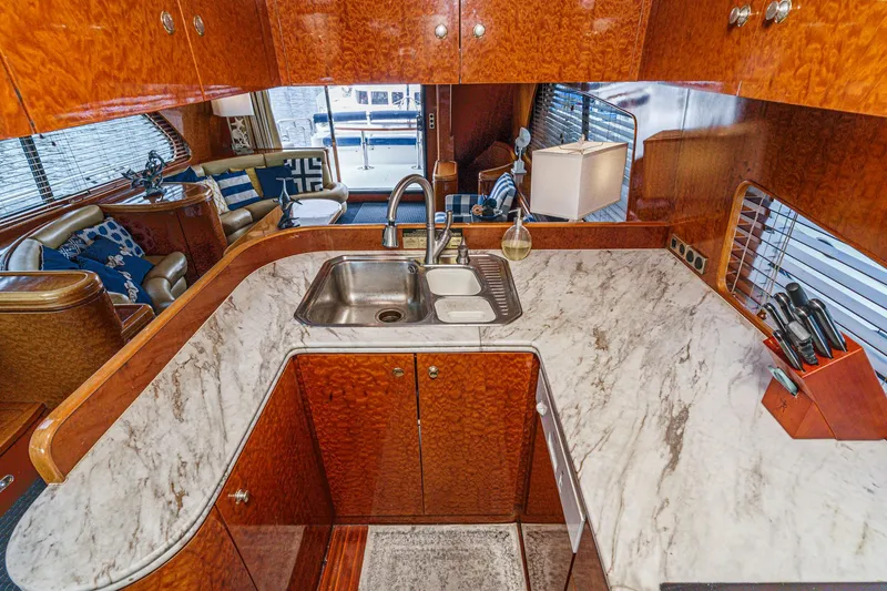 Slide: The Image of Luxurious kitchen interior of a 1999 Horizon 70 Motor Yacht with marble countertops. - 36
