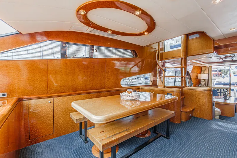 Slide: The Image of Luxurious interior of 1999 Horizon 70 Motor Yacht with polished wood and elegant dining area. - 39
