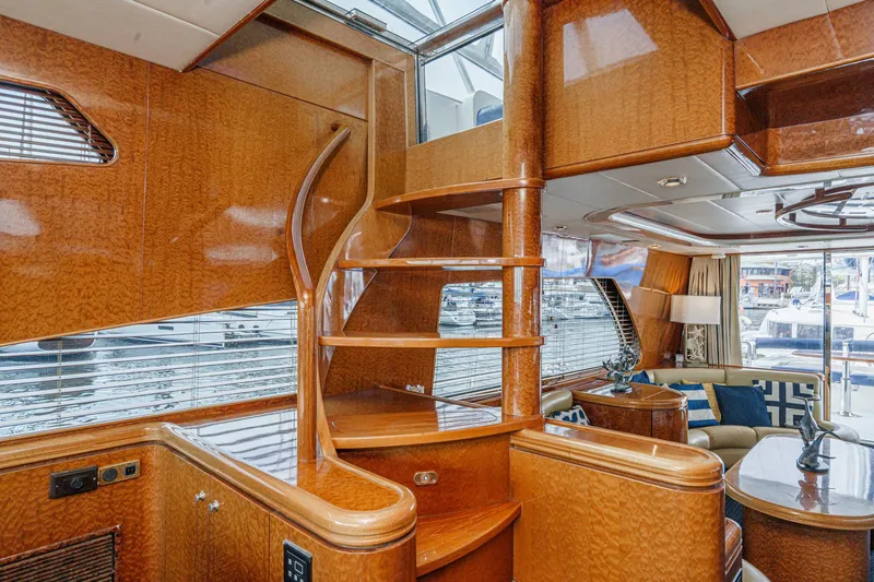 Slide: The Image of Luxurious interior of a 1999 Horizon 70 Motor Yacht with elegant wood finishes. - 40