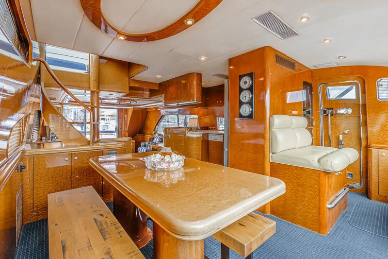 Slide: The Image of Luxurious interior of a 1999 Horizon 70 Motor Yacht with polished wood and modern amenities. - 41