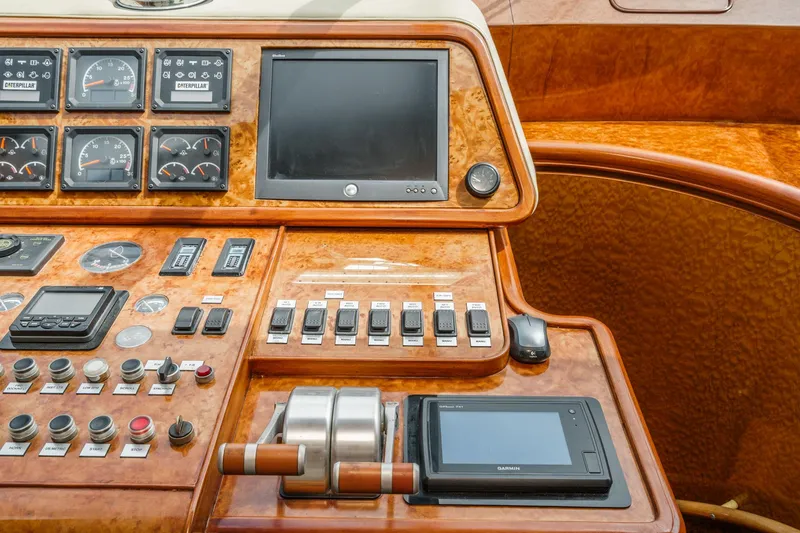 Slide: The Image of Control panel of a 1999 Horizon 70 Motor Yacht with gauges and navigation equipment. - 45