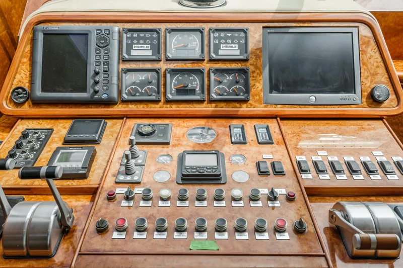 Slide: The Image of Control panel of a 1999 Horizon 70 Motor Yacht with navigation and monitoring instruments. - 46