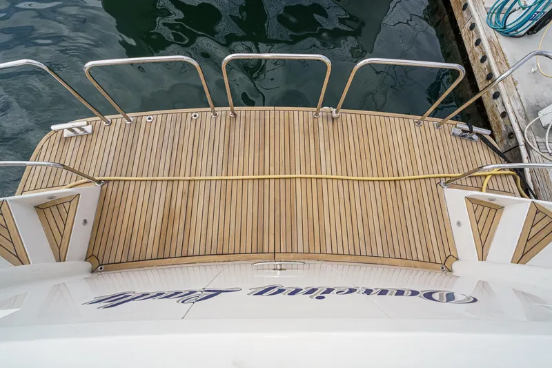 Slide: The Image of Teak deck of 1999 Horizon 70 Motor Yacht at dockside. - 9