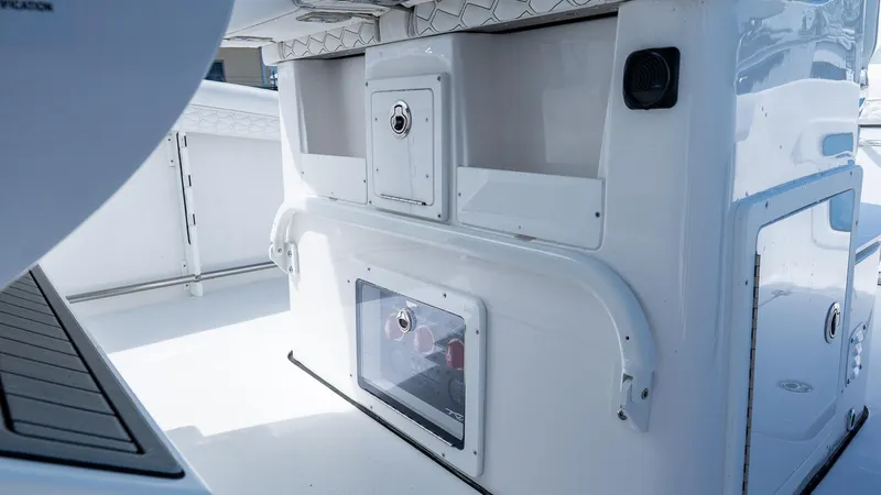 Slide: The Image of 2026 Tidewater 282CC Adventure boat interior, featuring storage compartments and sleek design. - 14