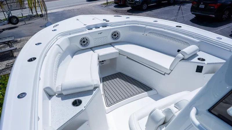 Slide: The Image of 2026 Tidewater 282CC Adventure boat interior with white seating and modern design. - 22