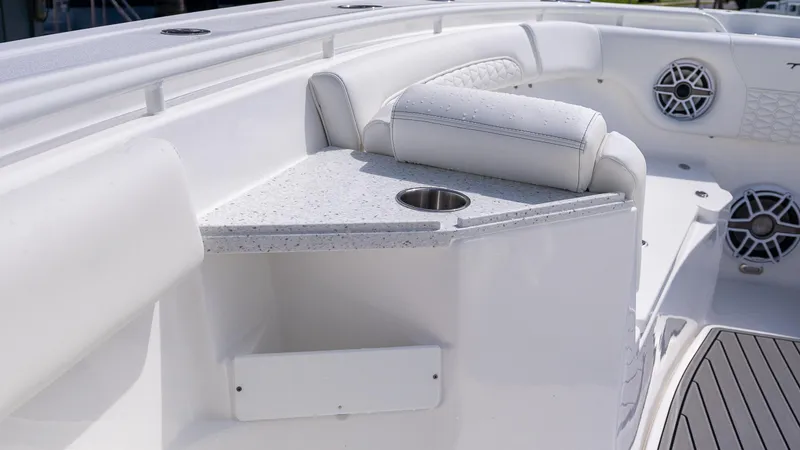 Slide: The Image of 2026 Tidewater 282CC Adventure boat interior with seating, cup holder, and speakers. - 24