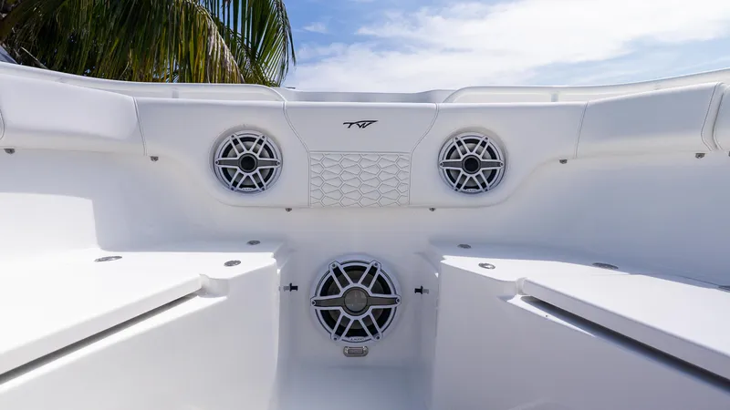 Slide: The Image of 2026 Tidewater 282CC Adventure boat interior with speakers and sleek white design. - 27