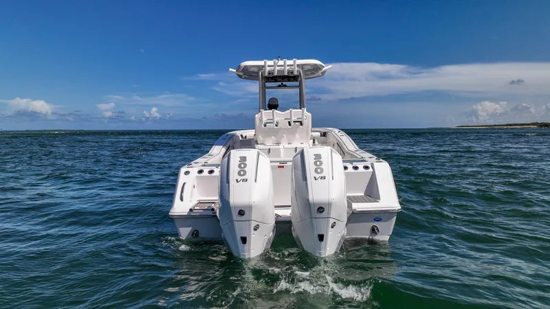 Slide: The Image of 2026 Tidewater 282CC Adventure boat with dual engines on open water. - 31