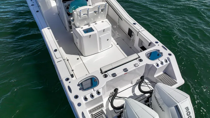 Slide: The Image of 2026 Tidewater 282CC Adventure boat with dual engines on open water. - 32