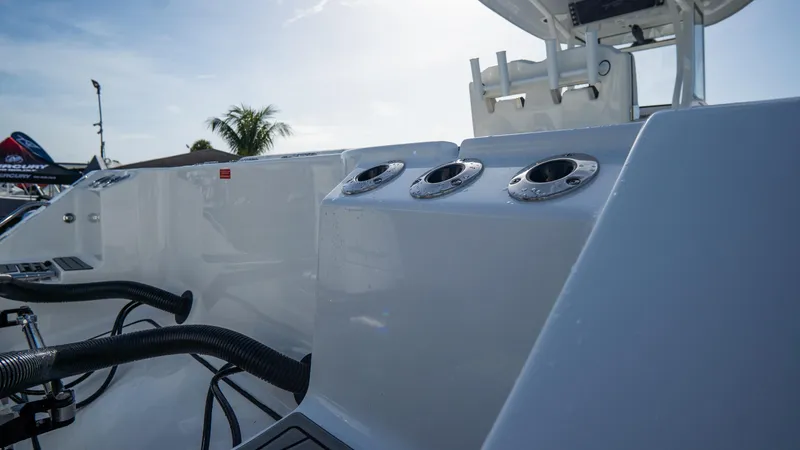 Slide: The Image of 2026 Tidewater 282CC Adventure boat deck with rod holders and equipment. - 33