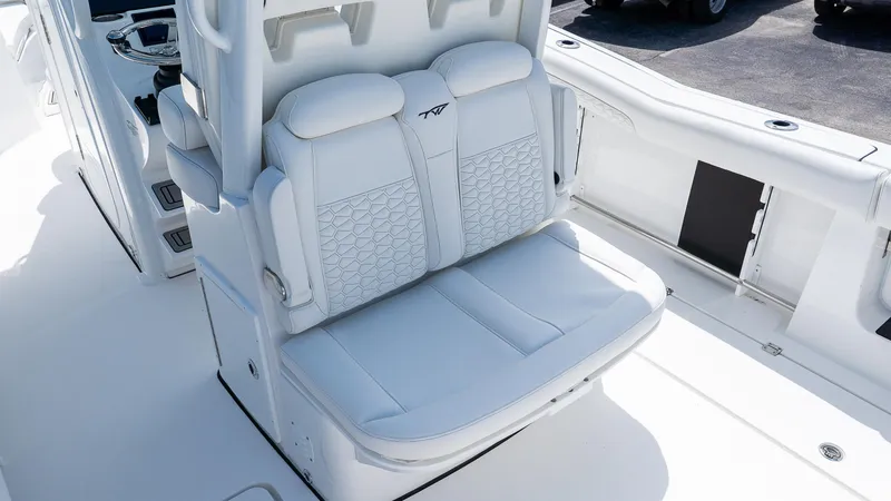 Slide: The Image of 2026 Tidewater 282CC Adventure boat with luxurious white seating and modern design. - 8