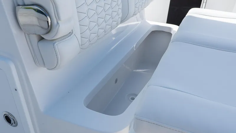 Slide: The Image of White seating and storage on 2026 Tidewater 282CC Adventure boat. - 9