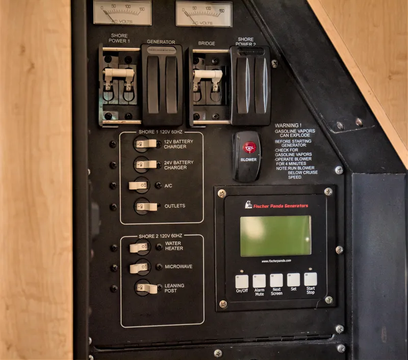 Slide: The Image of Electrical control panel on a 2014 Boston Whaler 370 Outrage boat. - 23