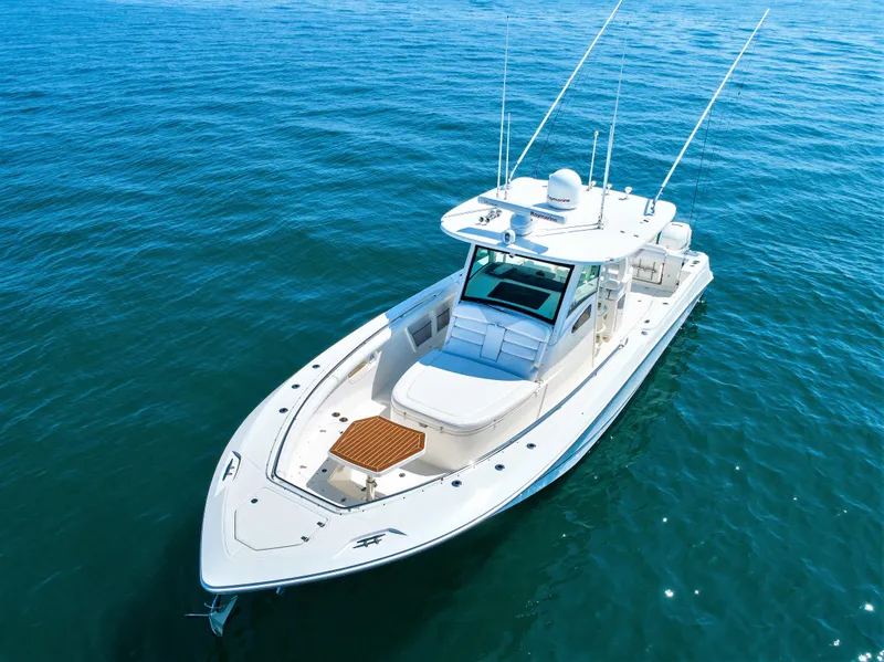 Slide: The Image of 2014 Boston Whaler 370 Outrage boat on calm blue water. - 4