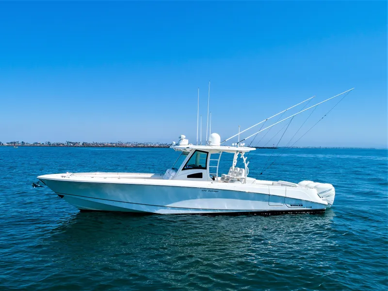 Slide: The Image of 2014 Boston Whaler 370 Outrage boat on calm blue ocean. - 5