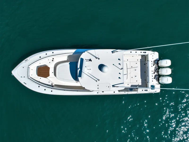 Slide: The Image of Aerial view of 2014 Boston Whaler 370 Outrage boat on clear blue water. - 6