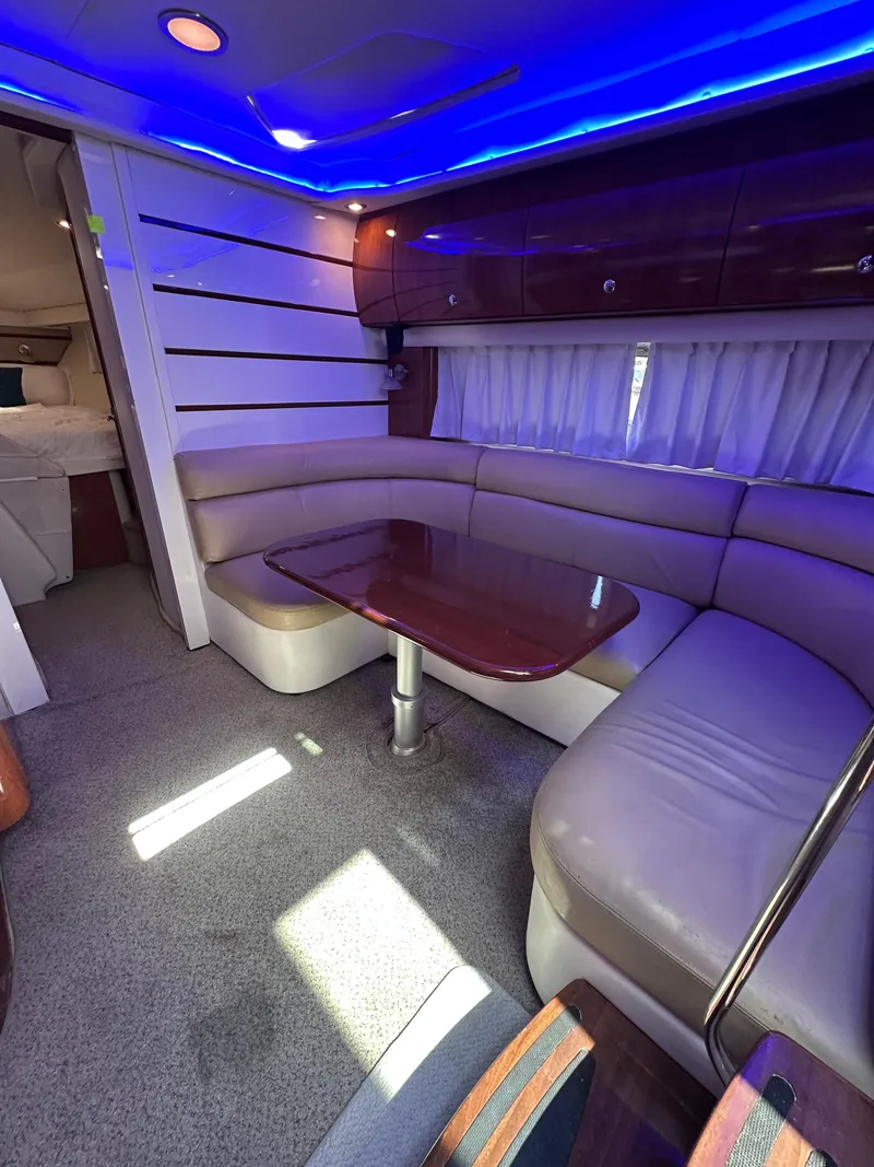 Slide: The Image of Luxurious 2008 Four Winns V458 yacht interior with blue LED lighting and plush seating. - 18