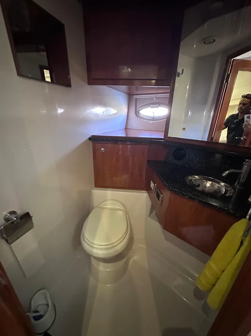 Slide: The Image of Luxurious 2008 Four Winns V458 yacht bathroom with modern fixtures and wood cabinetry. - 20