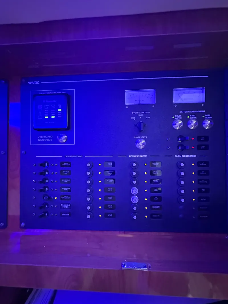 Slide: The Image of Control panel of a 2008 Four Winns V458 boat, featuring various switches and indicators. - 26