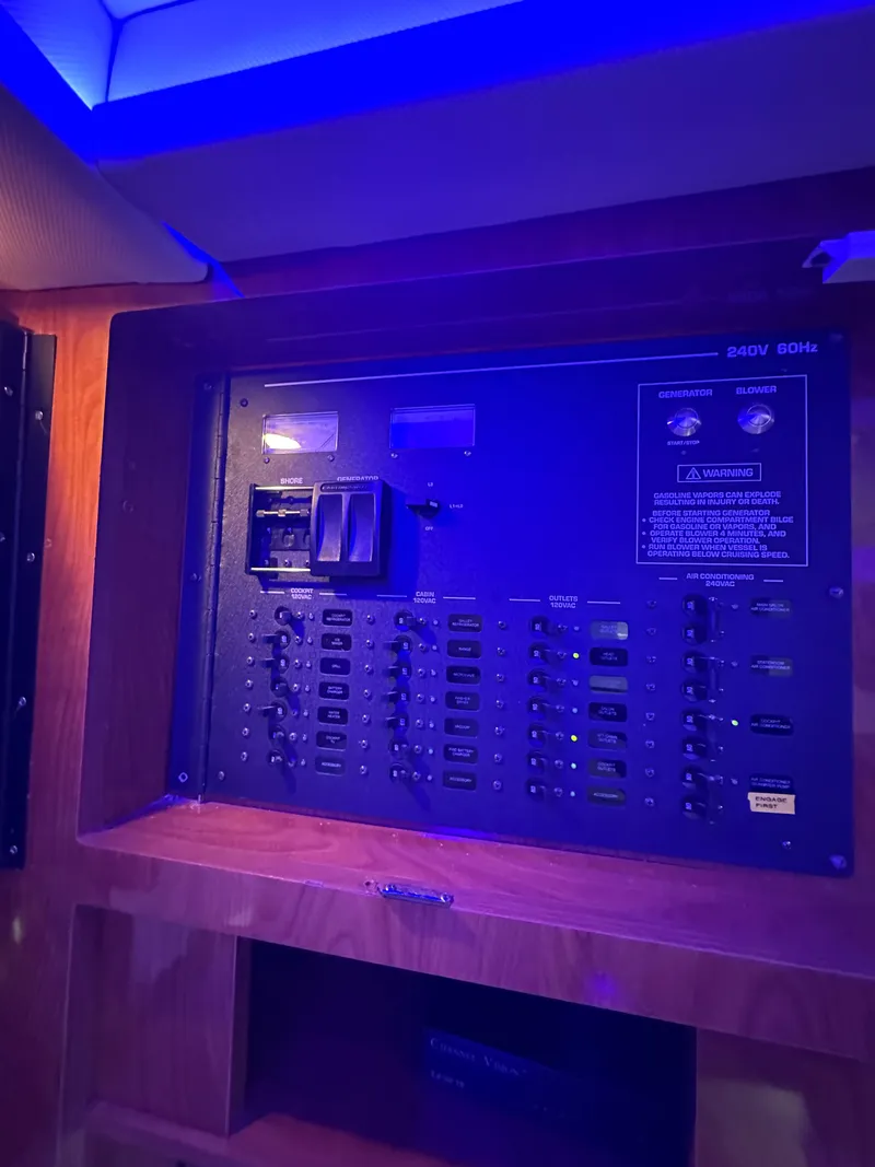 Slide: The Image of Electrical panel on 2008 Four Winns V458 boat, illuminated by blue lighting. - 27