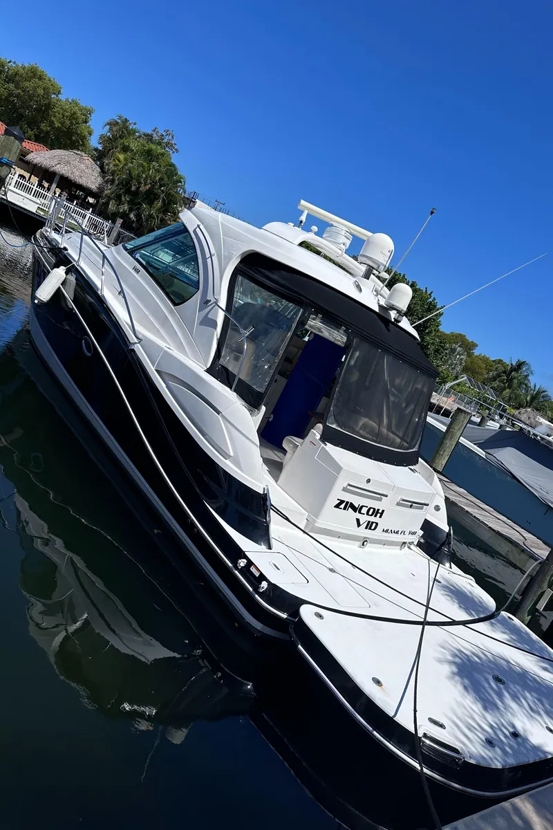 Slide: The Image of 2008 Four Winns V458 yacht docked in a marina under clear blue skies. - 3