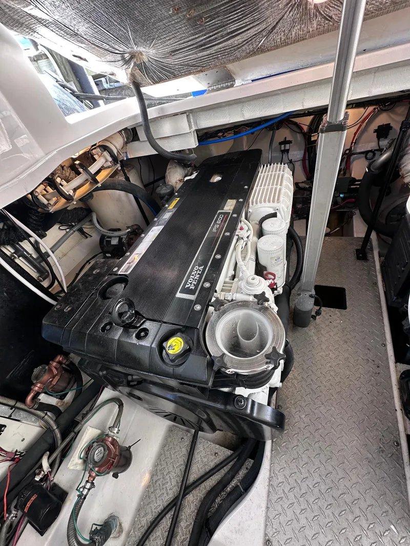 Slide: The Image of Engine compartment of a 2008 Four Winns V458 boat, featuring a Volvo Penta engine. - 36