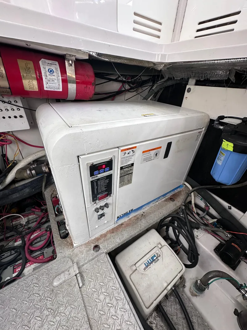 Slide: The Image of Engine room of 2008 Four Winns V458 with Kohler generator and fire extinguisher. - 41