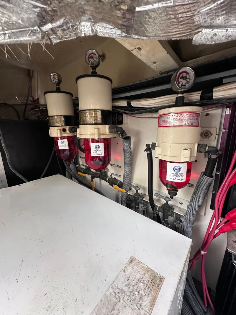 Slide: The Image of Engine room of 2008 Four Winns V458 with fuel filters and gauges. - 43