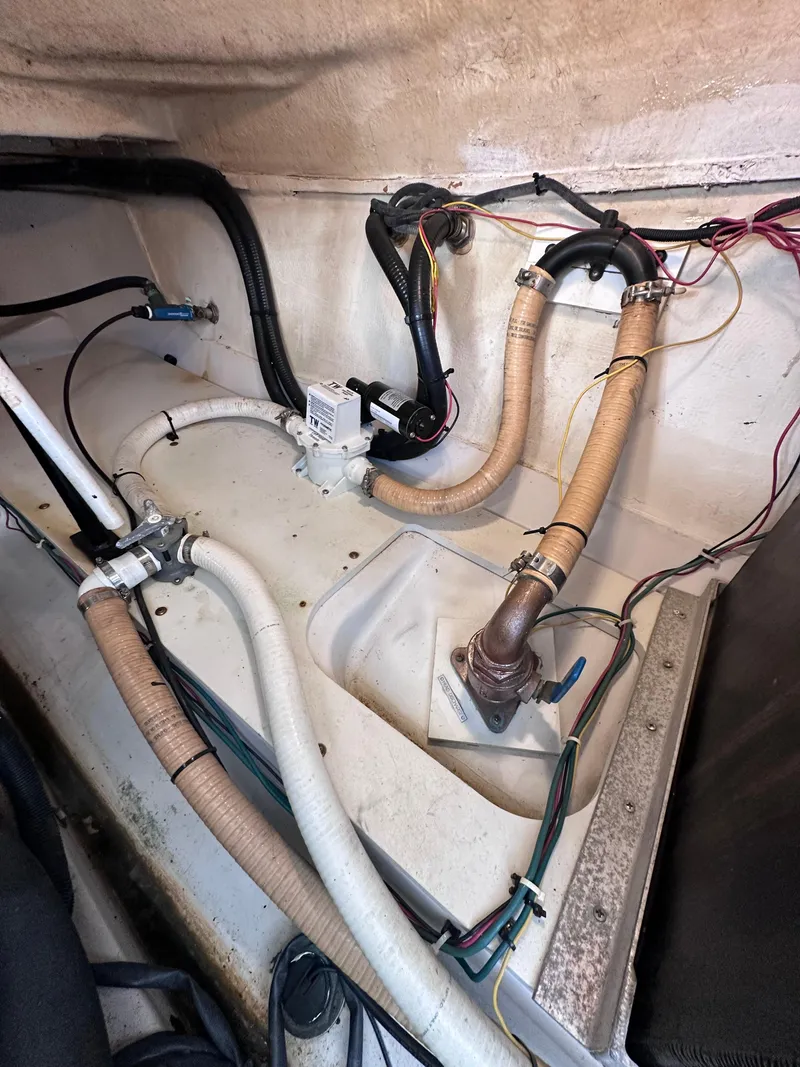 Slide: The Image of 2008 Four Winns V458 engine compartment with hoses and wiring. - 44